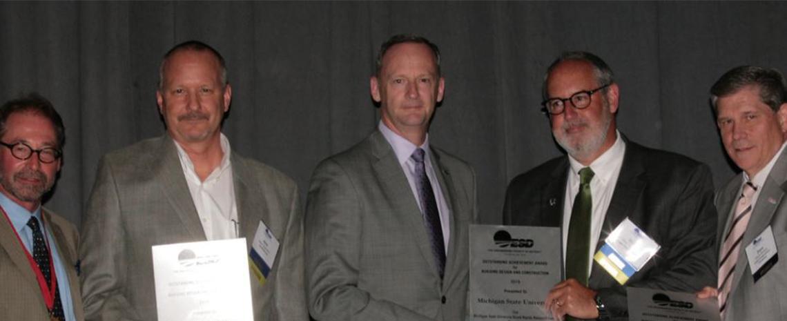 Photo of Dick Temple accepting Engineering Society of Detroit 2019 Construction and Design Award