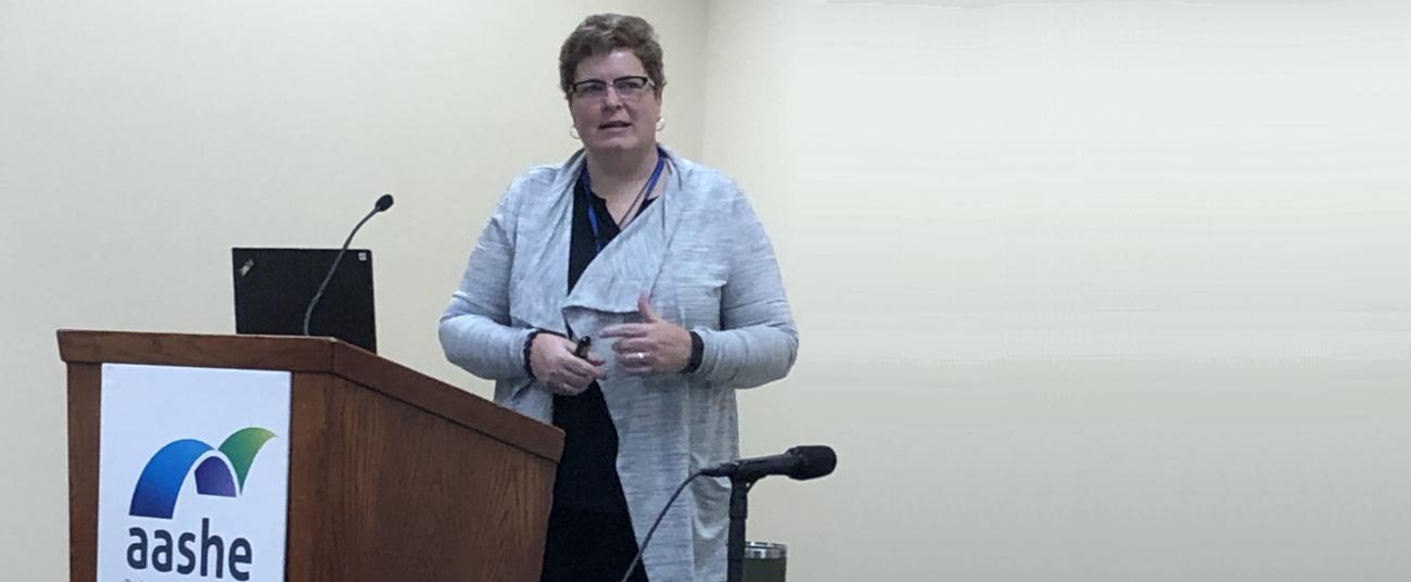 Photo of Ann Erhardt speaking at the 2019 AASHE conference