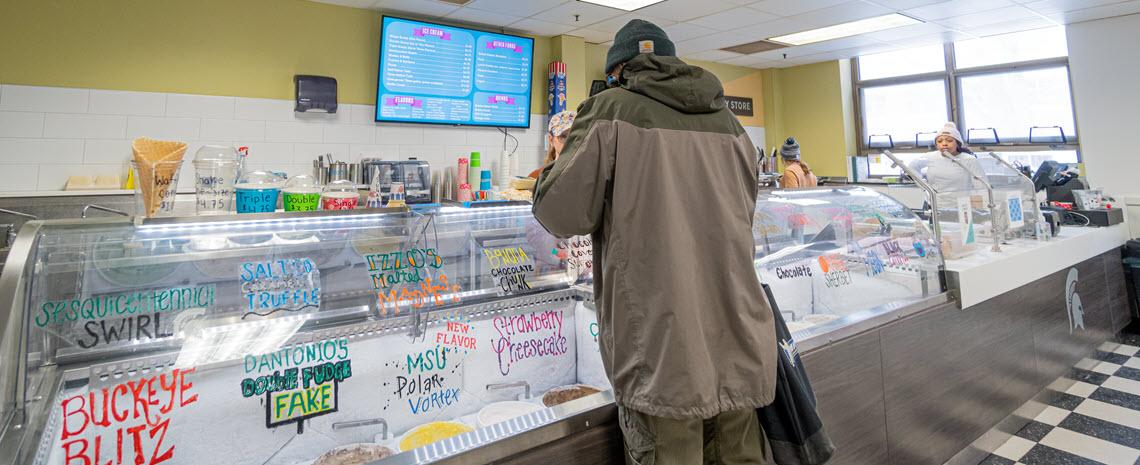 Photo of customer ordering ice cream at newly renovated Dairy Store front counter