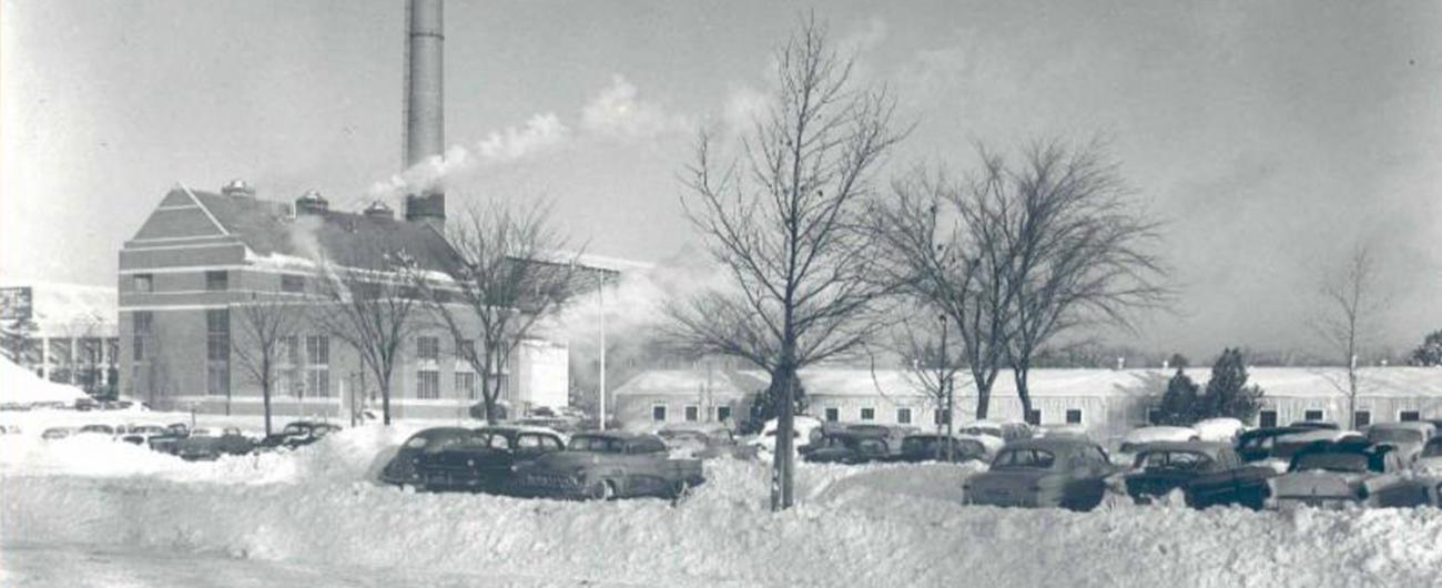 Photo of the MAC Power Plant and vehicles in a parking lot