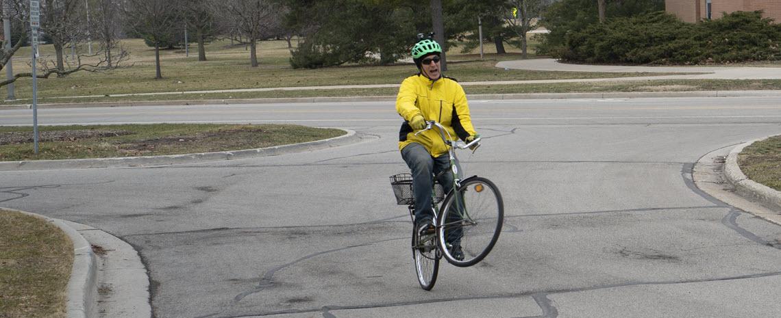 Tim Potter performing a wheelie on a bicycle