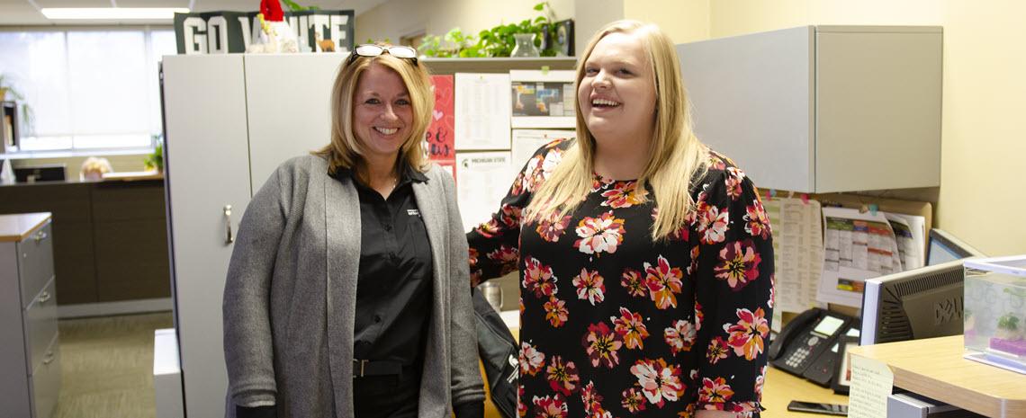 Photo of Angie Zell and Jamie Talbert taken in their office prior to the COVID outbreak