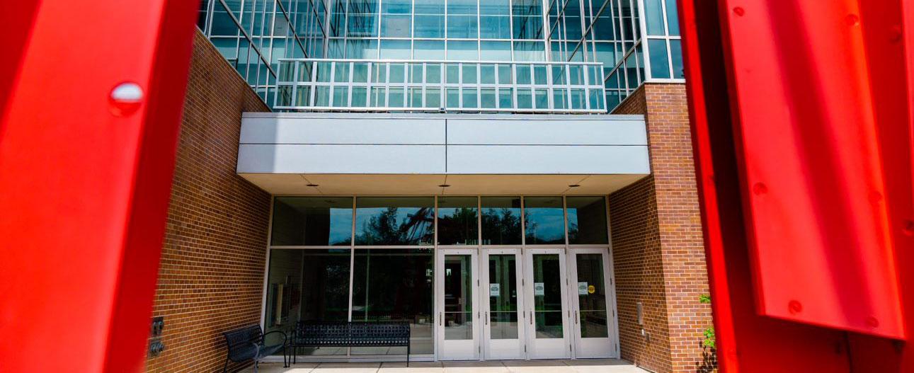 A row of transparent panes of glass installed above entrance doors.