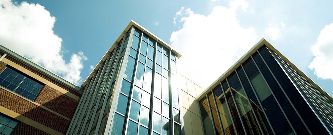 STEM Teaching and Learning facility with blue sky and clouds