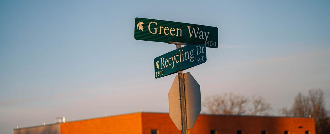 MSU street signs at intersection: Green Way and Recycling Drive
