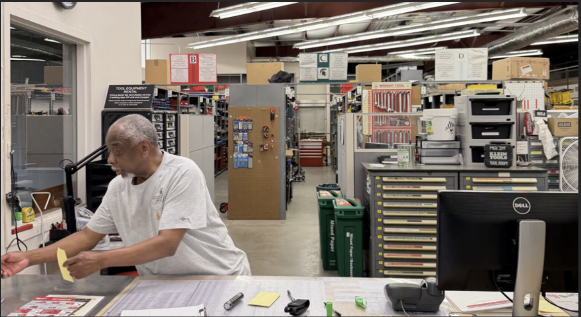 Robyn Perry filing a paper in the tool room